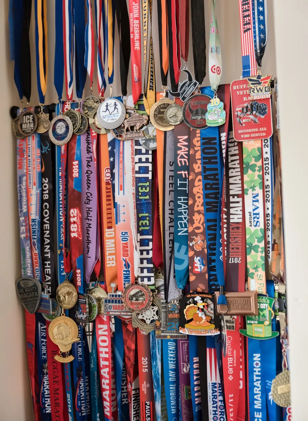 Krystalore Crews' wall of race medals and ribbons